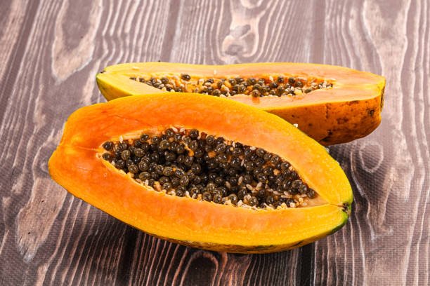 Ripe sweet juicy papaya fruit cut